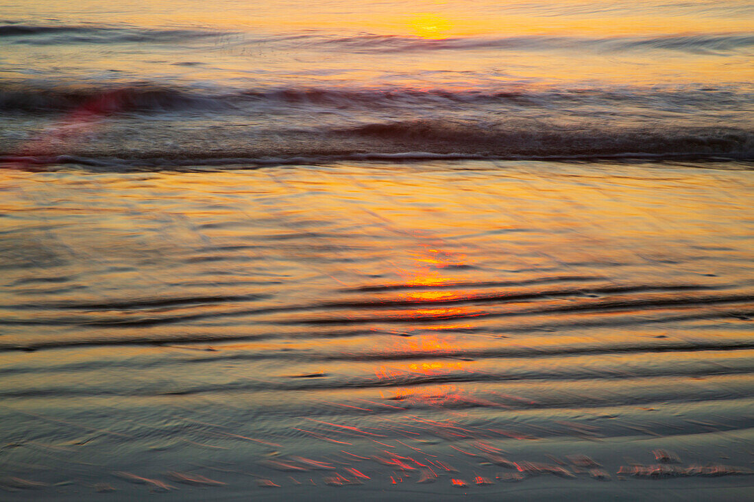 USA, Georgia, Tybee Island. Sunrise with ripples in the sand