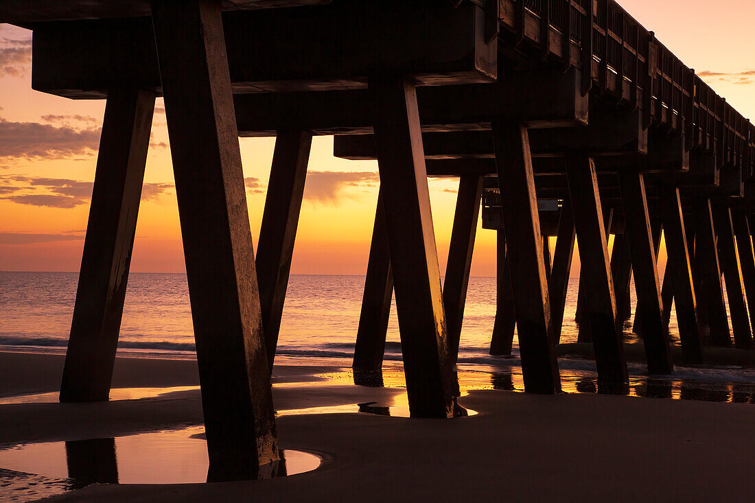 USA, Georgia, Tybee Island. Pier silhouetted in the sunrise.