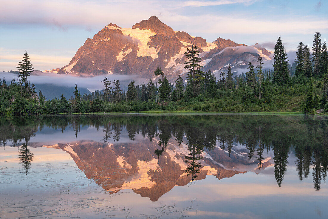 Mount Shuksan reflected in Picture Lake. Heather Meadows Recreation Area, Mount Baker Snoqualmie National Forest. North Cascades, Washington State