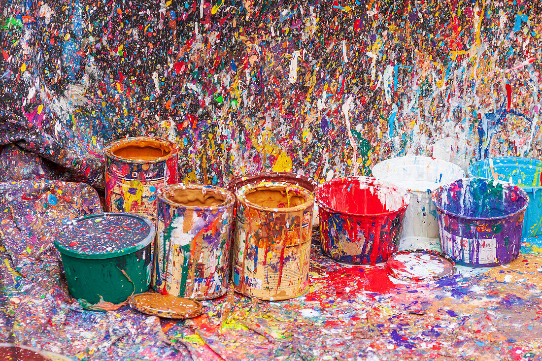 Argentina, Buenos Aires. Colorful paint splatters and buckets.