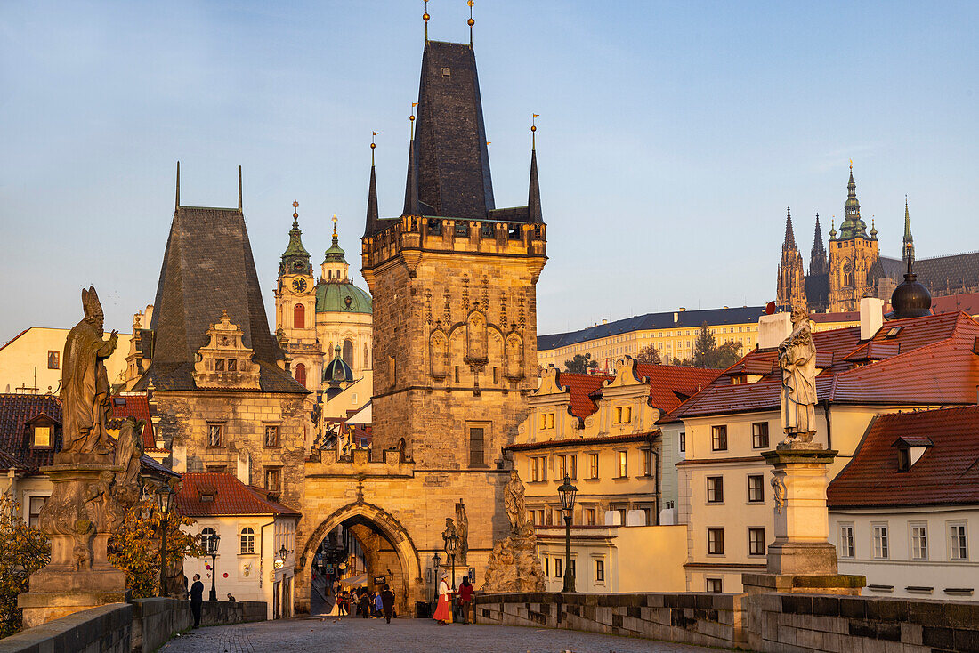 Arch of Lesser Town Bridge Tower on Charles Bridge with St. Nicholas Church in Prague, Czech Republic