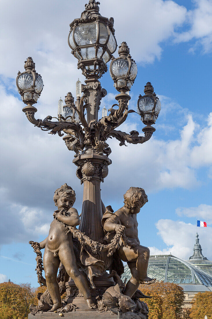 Paris. Decorative street lamps, at Pont Alexandre III, along River Seine.