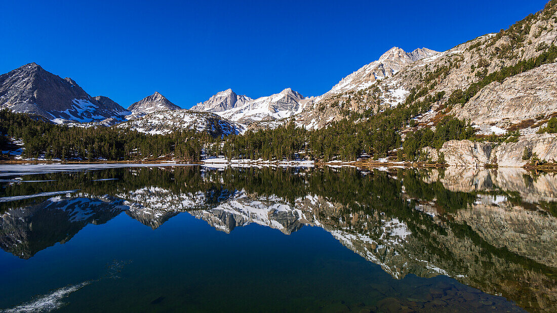 Sierra peaks reflected in Long Lake, Little Lakes Valley, John Muir Wilderness, California, USA