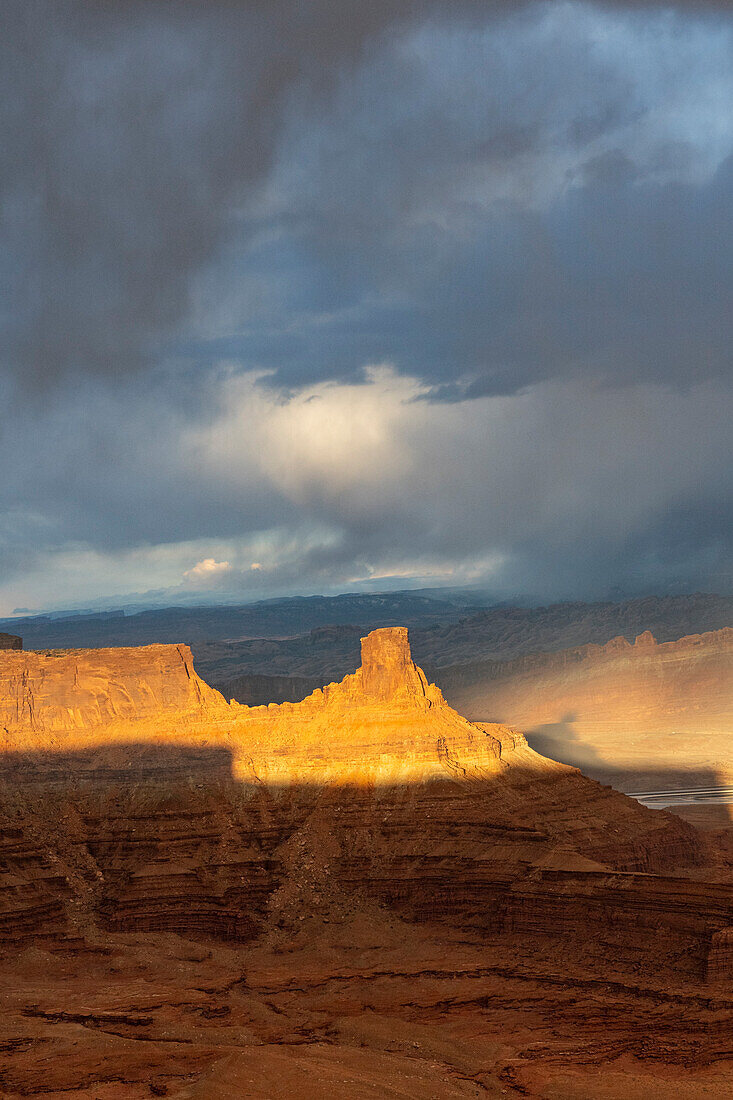 USA, Utah. Sunset light breaking through desert storm clouds, Dead Horse State Park.