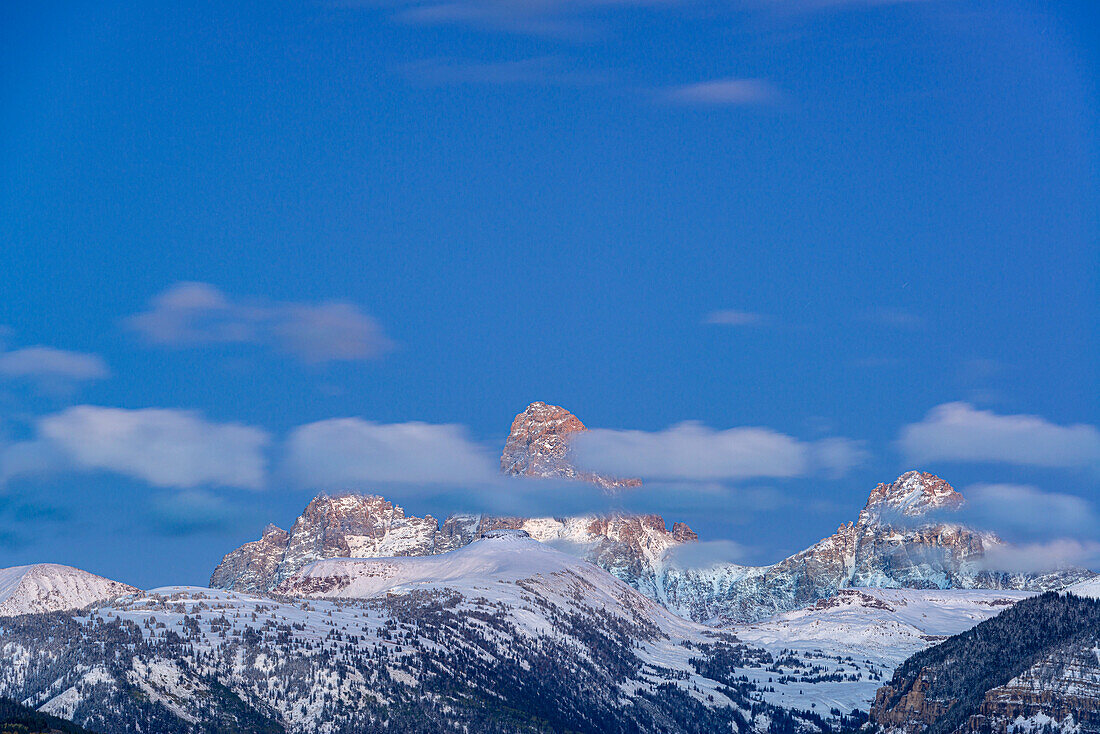 USA, Wyoming. Evening landscape of clouds over Grand Teton from the west