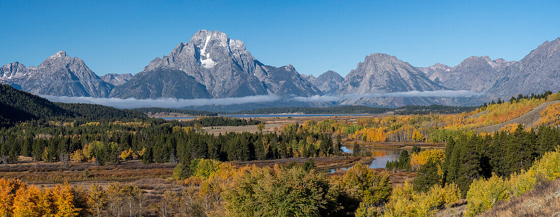 USA, Wyoming. Mount Moran and autumn aspens at the Oxbow, Grand Teton National Park.