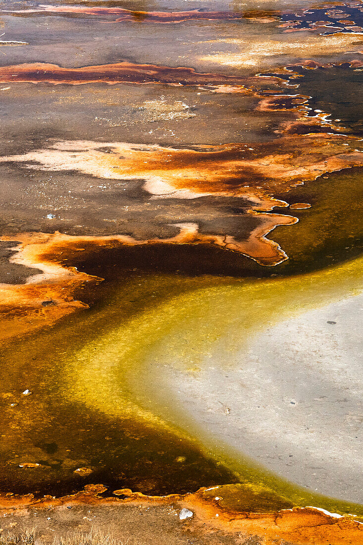 USA, Wyoming. Colorful abstract designs of hydrothermal pools near Great Fountain Geyser, Yellowstone National Park.