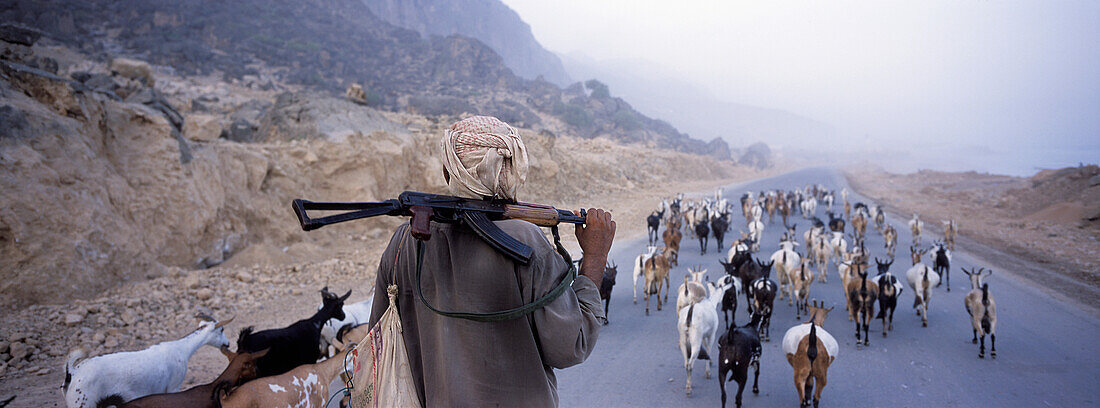 Goat Herder With Ak47 Over Shoulder