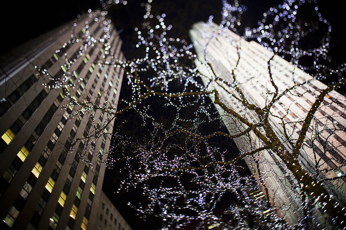 Looking up at the Rockefeller building at night; New York City, New York, United States of America