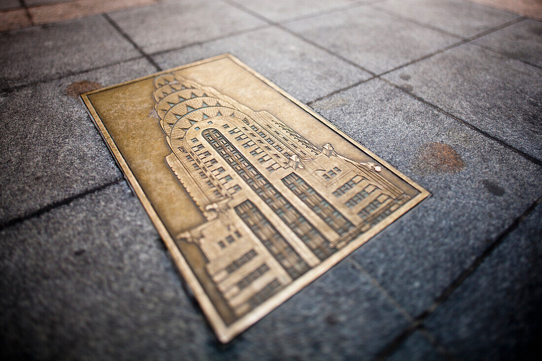 Brass plaque of Chrysler building in the sidewalk. New York. USA.