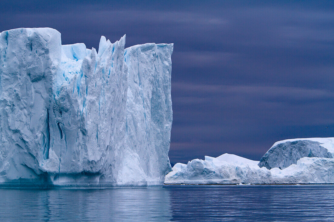 A Midnight Cruise Around The Ilulissat Ice Fjord, One Of Unesco World Heritage Sites. Greenland.