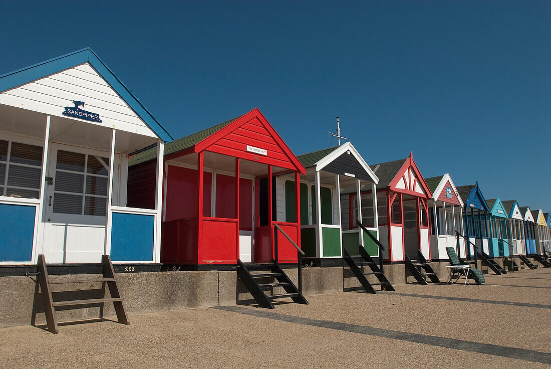 Traditional beach huts on the seafront at Southwold, Suffolk, UK
