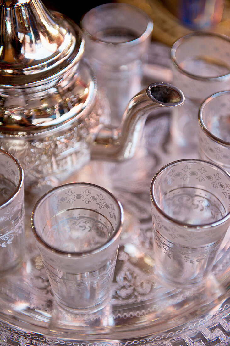 Morocco, Small glasses and teapot on tray; Marrakesh