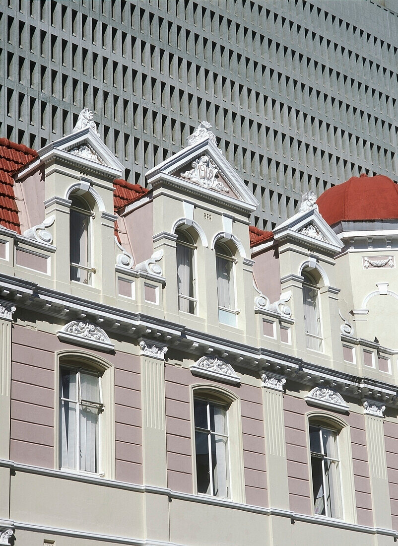 Old Colonial Building In Front Of Large Modern Concrete Office Block, Cape Town, South Africa.