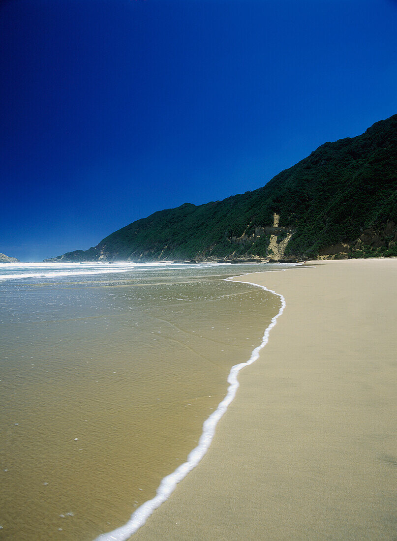 Looking Along Deserted Beach On The Garden Route Near The Town Of Wilderness, South Africa.
