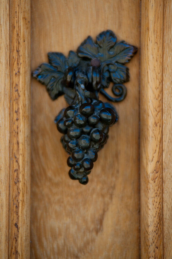 Spain, Basque Country, Detail of iron grape on door; Elciego