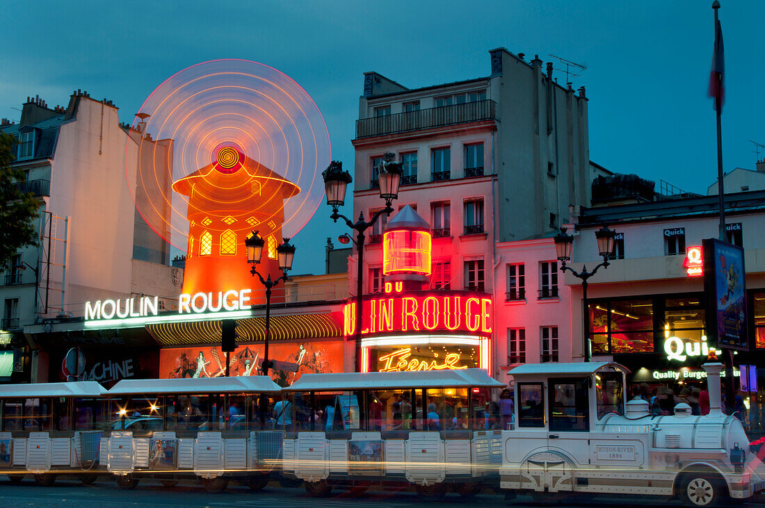France, Moulin Rouge dusk; Paris, Neon windmill sign