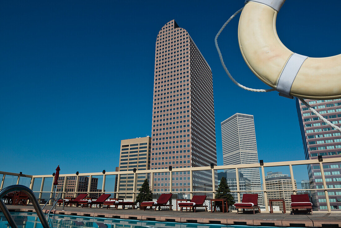 USA, Colorado, Downtown Denver skyline viewed from roof top pool of Warwick Hotel; Denver