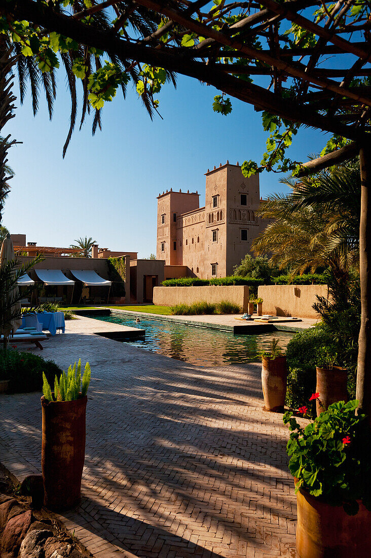 Morocco, Swimming pool and main Kasbah of Dar Ahlam hotel; Skoura