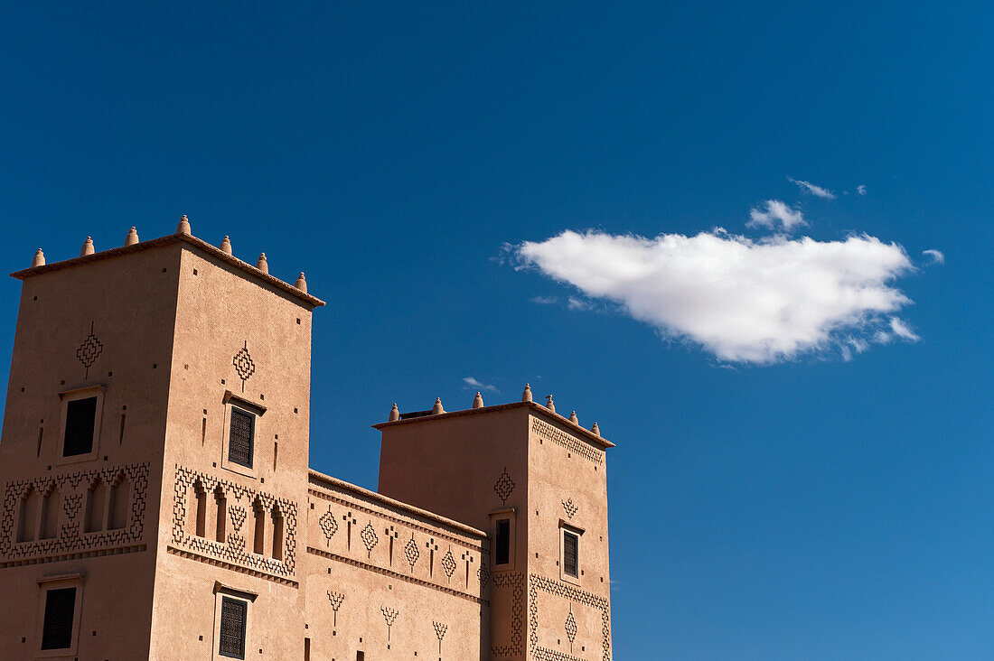 Morocco, Cloud and main kasbah of Dar Ahlam Hotel; Skoura