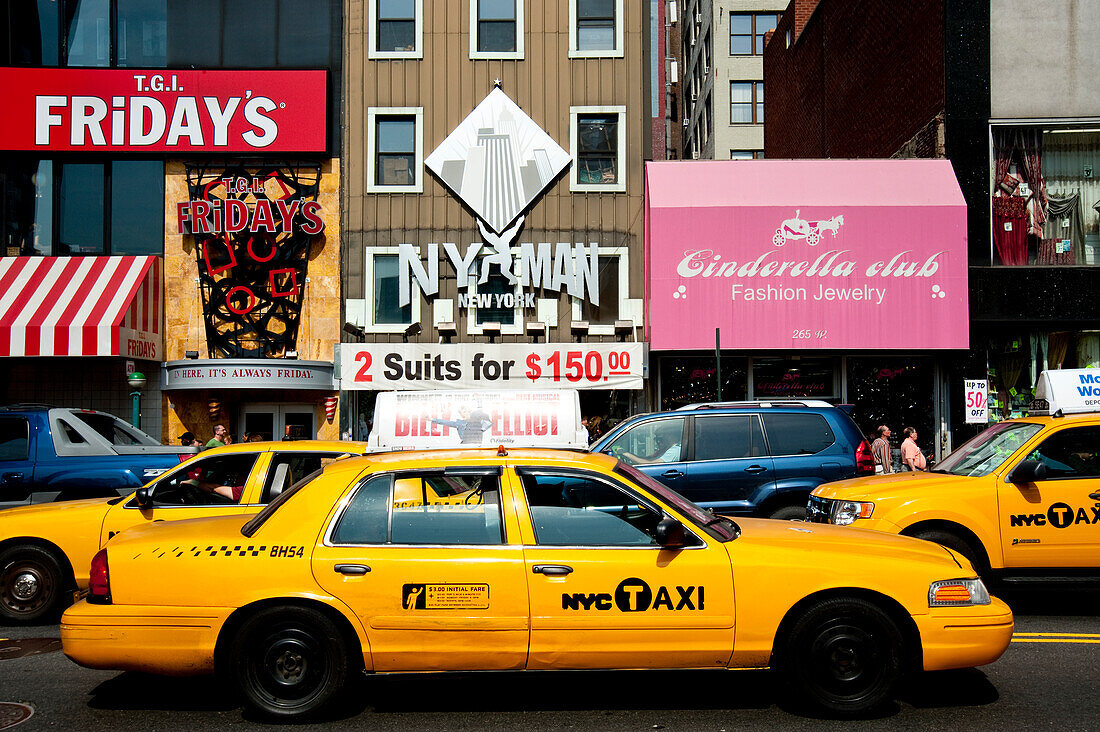 Ny Taxis In A Commercial Area In Manhattan, New York, Usa