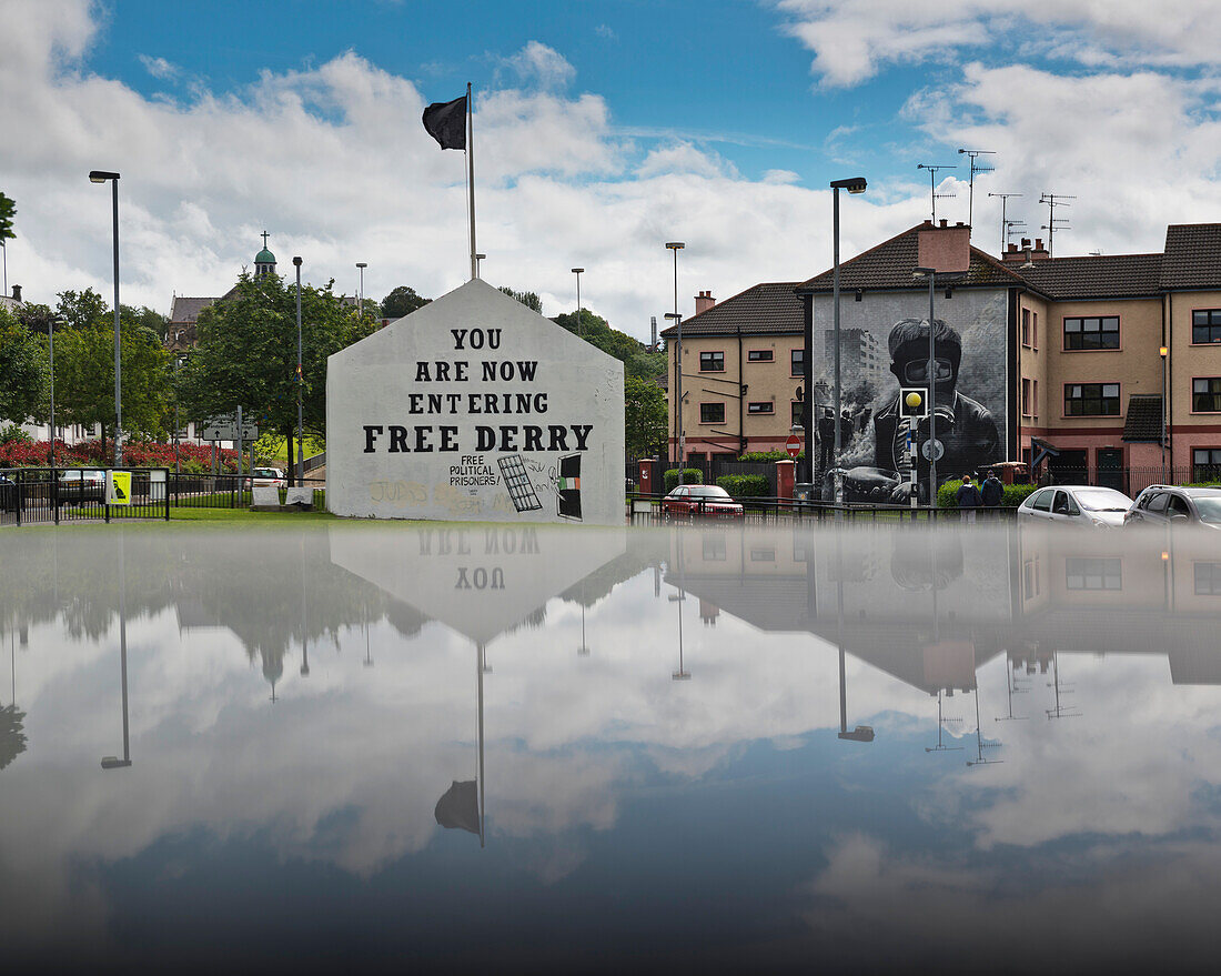 United Kingdom, Northern Ireland, County Londonderry, Reflected view of murals in Bogside Area; Derry