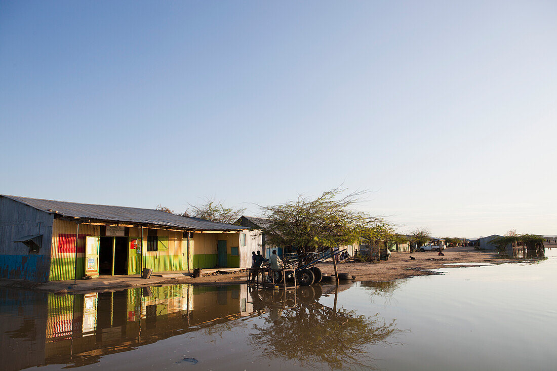 Kenya, View of village with flooded street; Turkana