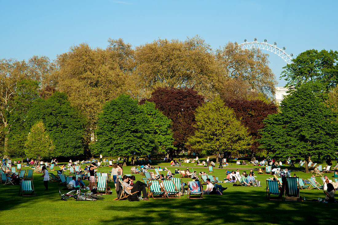 People Sunbathing On A Spring Day In Green Park, Central London, London, Uk