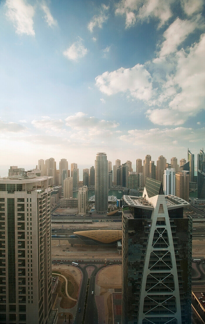 UAE, Dubai, Looking out across office and residential tower blocks; Dubai Marina