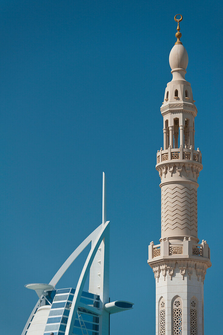 UAE, Minaret of small mosque in front of Burj Al Arab hotel; Dubai