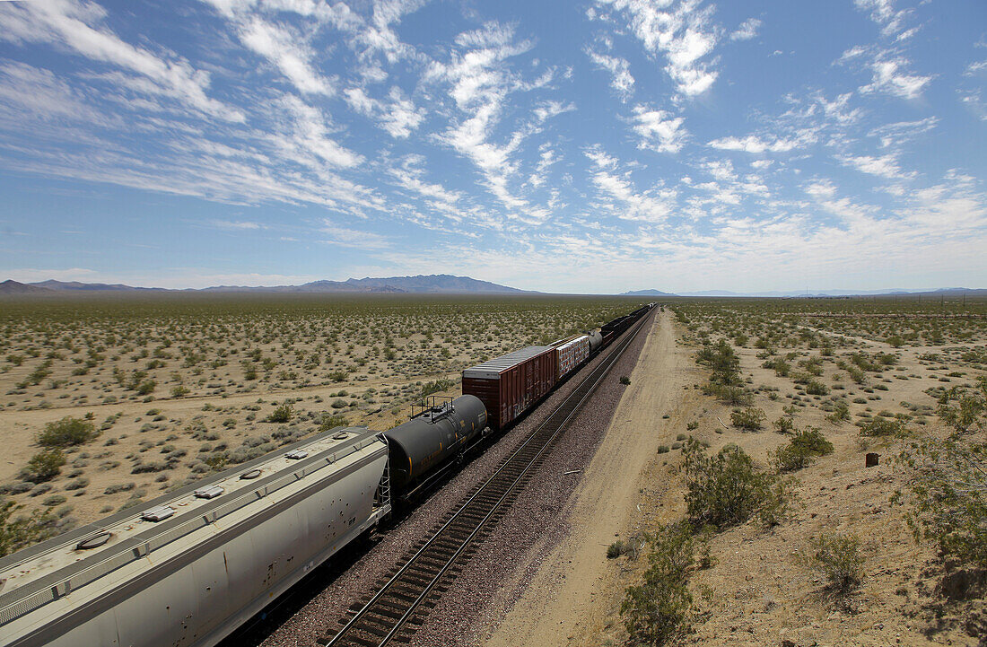 Usa, Freight Train Moves Through Desert Next To Route 66; California