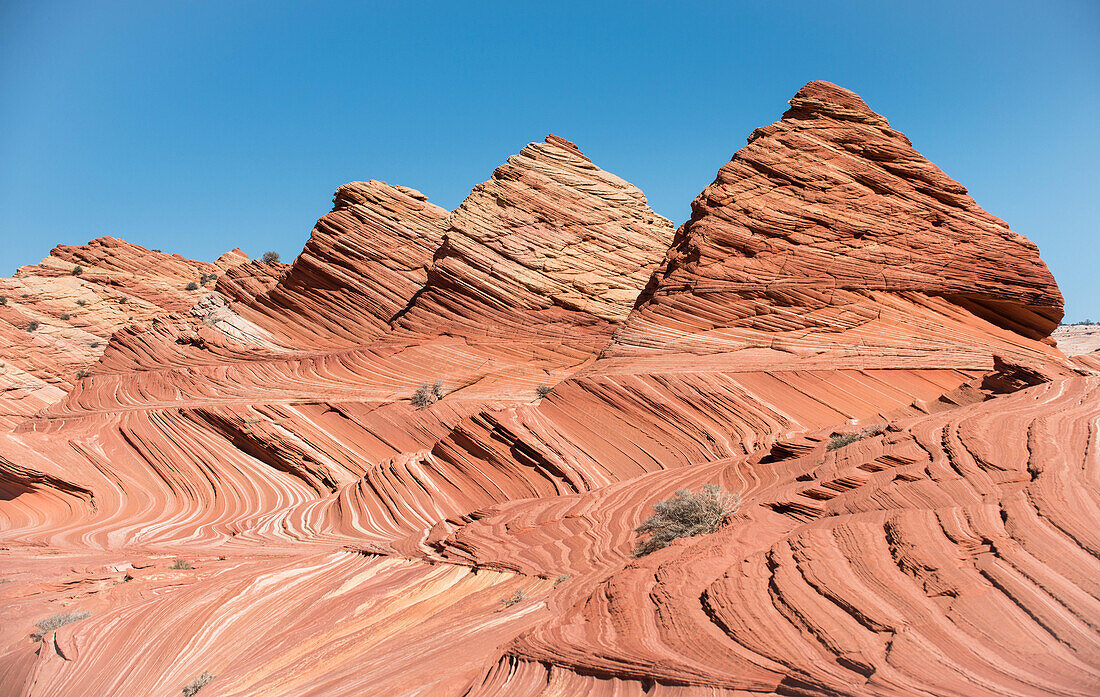 Pyramid shaped sandstone rock formations at Coyote Buttes North, part of the Paria Canyon-Vermilion Cliffs Wilderness area.
