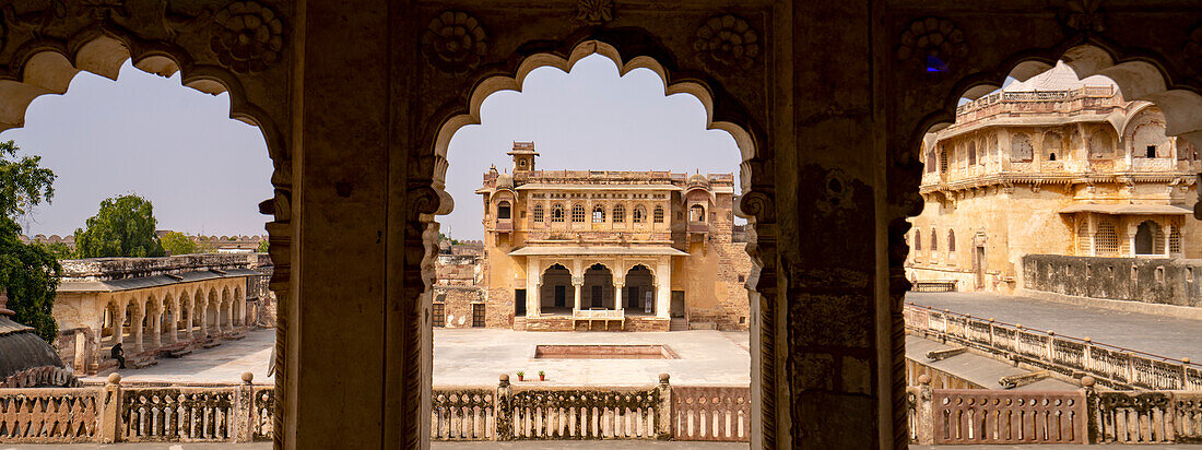 View looking through arches with colonnaded walkway and inner courtyard in Ahhichatragarh Fort (Nagaur Fort); Nagaur, Rajasthan, India