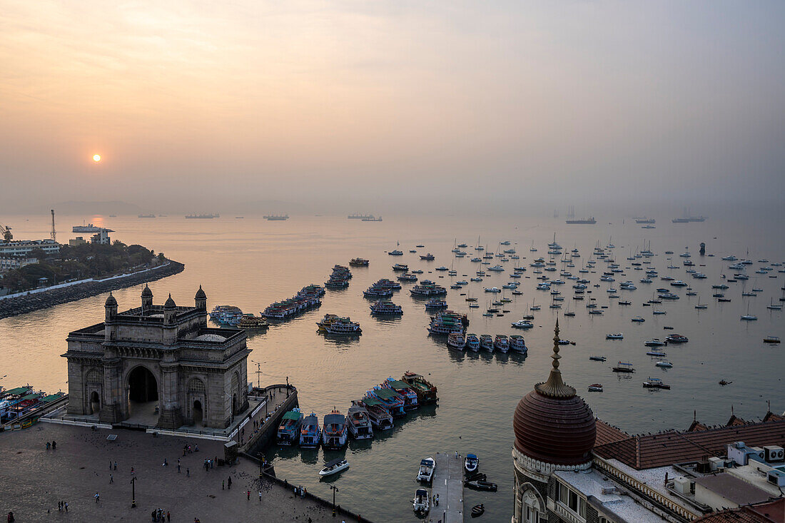 Sun rise over the harbor with the Gateway of India at dawn; Mumbai, Bombay, India