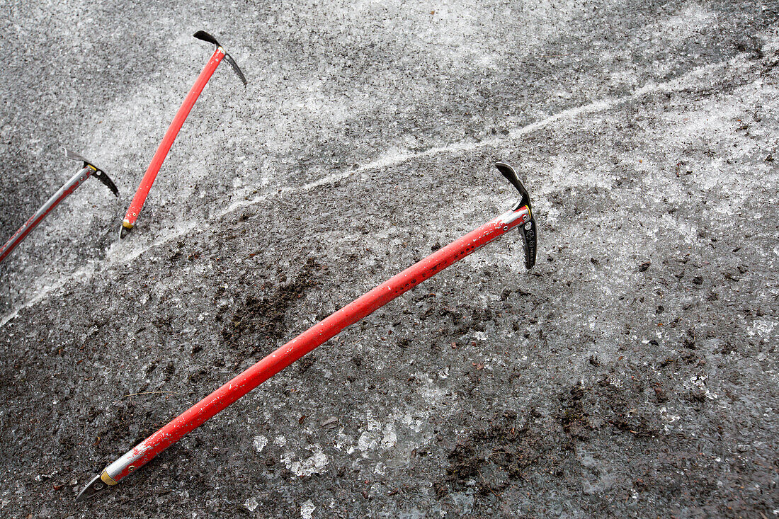 Ice axes are stuck in Skaftafell Glacier.; Skaftafell National Park, Iceland