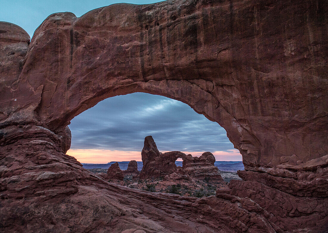 Turret arch viewed through Windows Arch in Arches National Park, Utah.