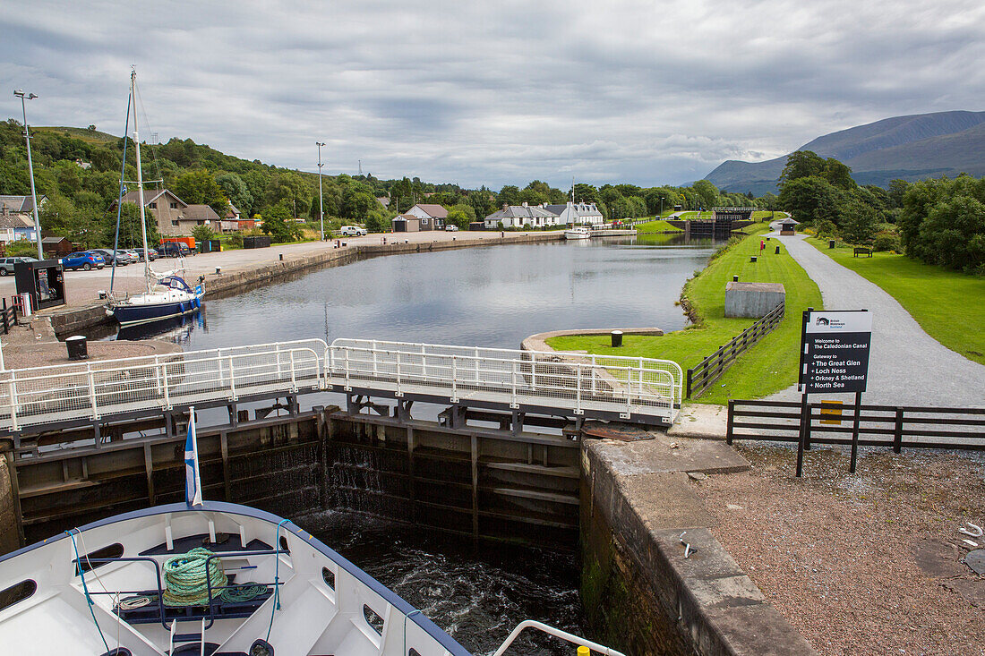 A small ship pulls into the Caledonian Canal, Scotland; Inverness, Scotland