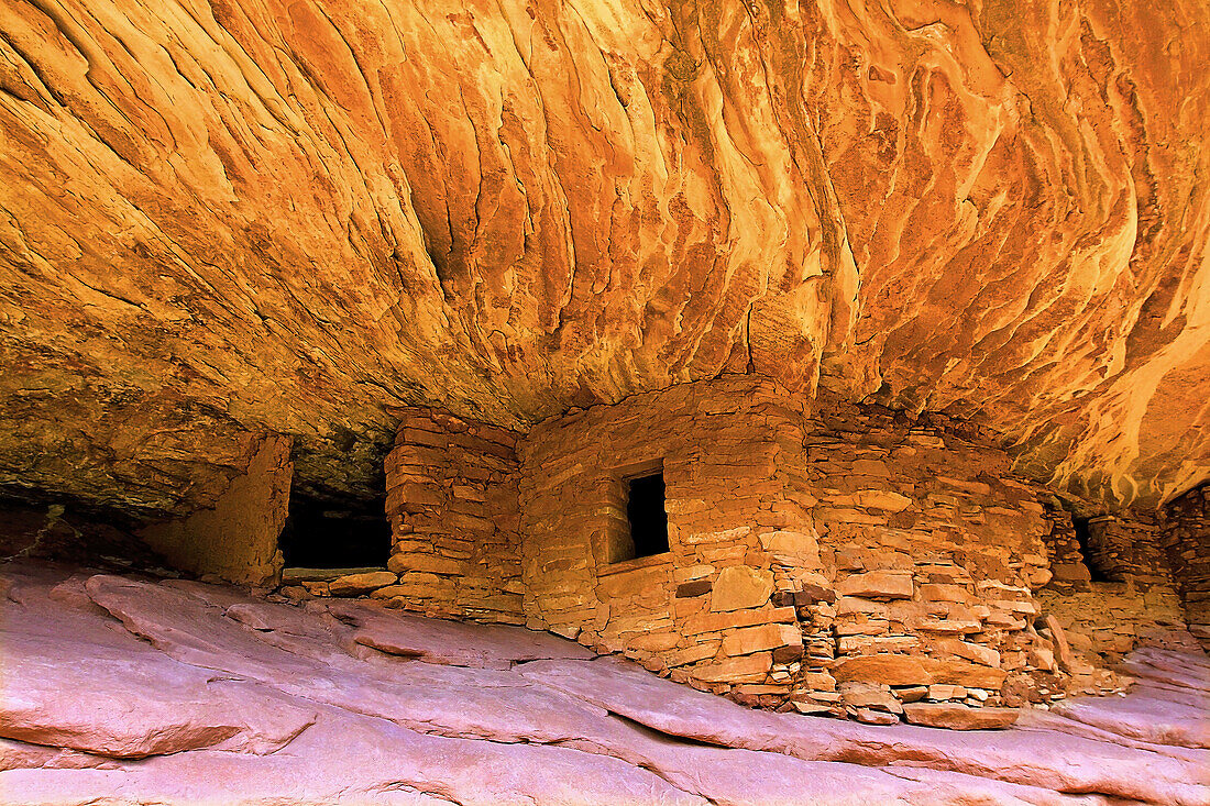 'House on Fire' ruins of the ancient Pueblos cliff dwellings, stone structures carved into the dramatic, jagged adobe cliffs in Cedar Mesa at the South Fork of Mule Canyon; Utah, United States of America