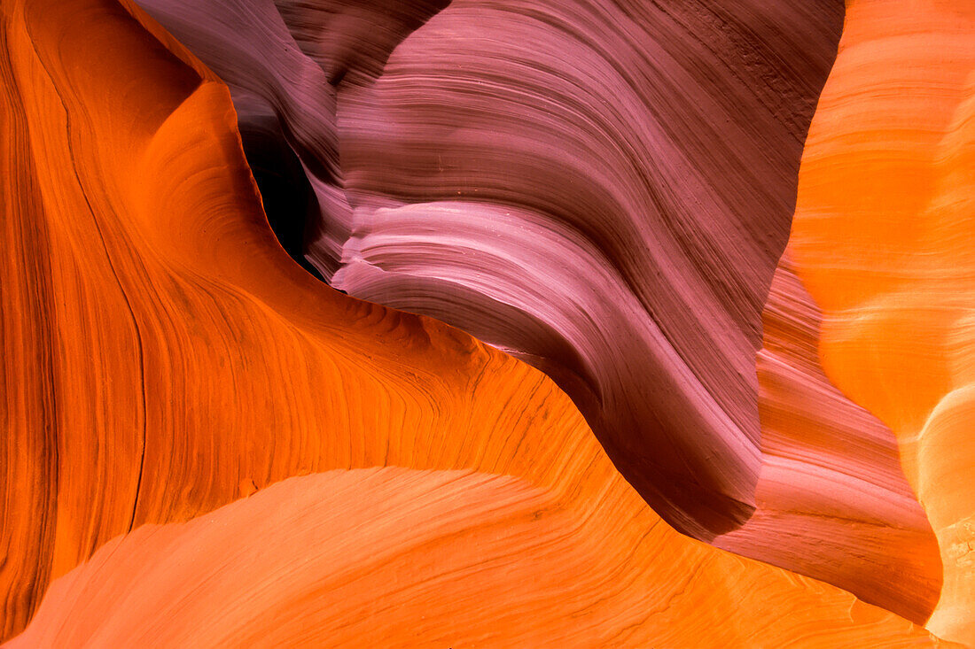 Wavy, abstract patterns in the colorful sandstone rock in Upper Antelope Canyon; Antelope Canyon, Arizona, United States of America
