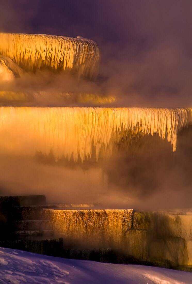 Travertine formations and steam vapors of the Minerva Terrace at the Mammoth Hot Springs in Yellowstone Natural Park; Wyoming, United States of America
