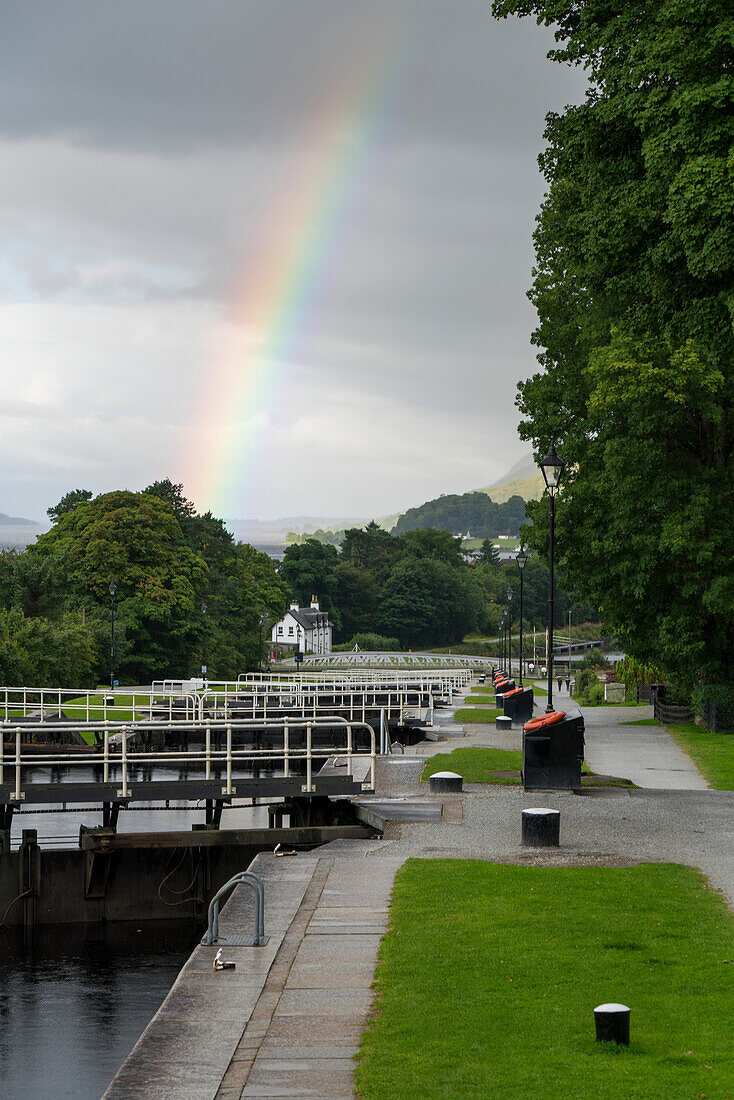 A rainbow stretches across the sky over Neptune's Staircase along the Caledonian Canal near Corpach, Scotland; Corpach, Scotland
