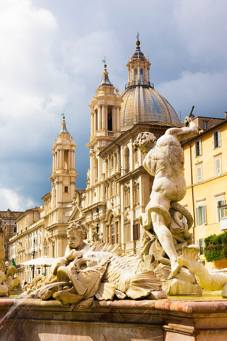 Fountain of Neptune and Church of St Agnese in Agonein in the background, Piazza Navona; Rome, Lazio, Italy