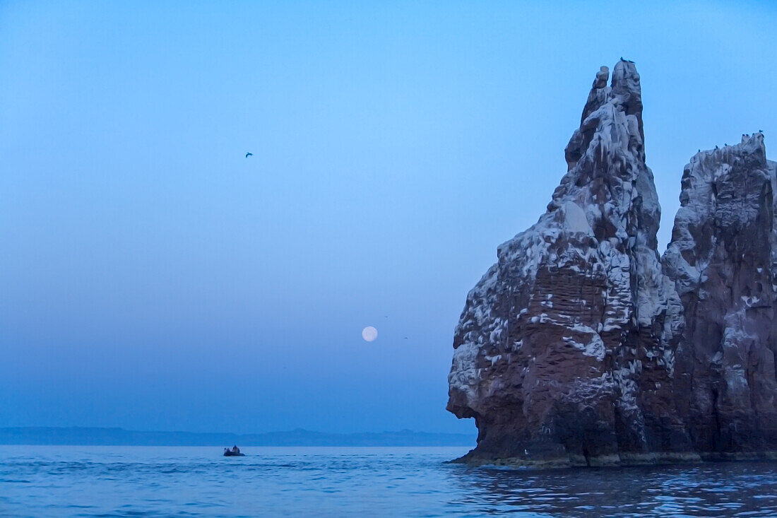 Zodiac and full moon at Los Islotes, Baja California, Mexico.
