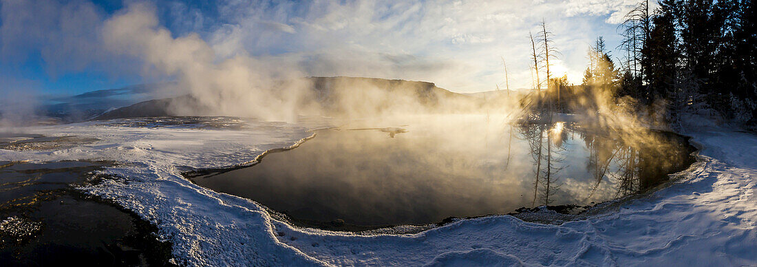 Steam rises from a natural hot spring.