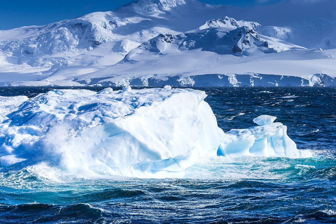 Icebergs and mountains near Cuverville Island, Antarctica.