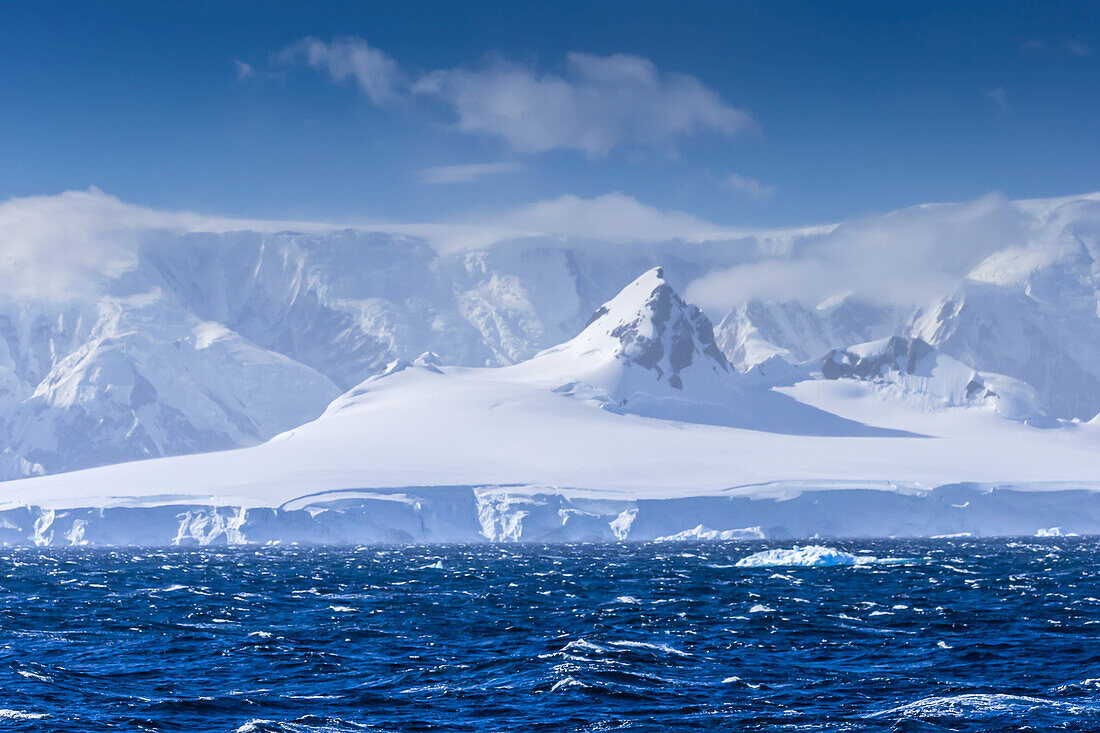 Icebergs and mountains near Cuverville Island, Antarctica.