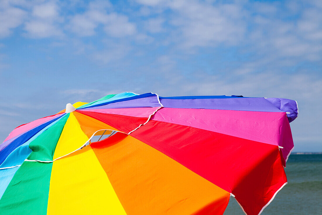 A beach umbrella and a blue sky on Martha's Vineyard.