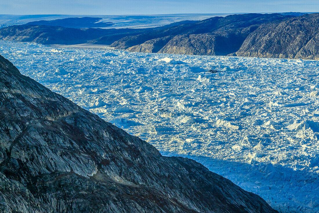 Aerial of icebergs from Helheim Glacier and Greenland Icesheet choking Sermilik Fjord.