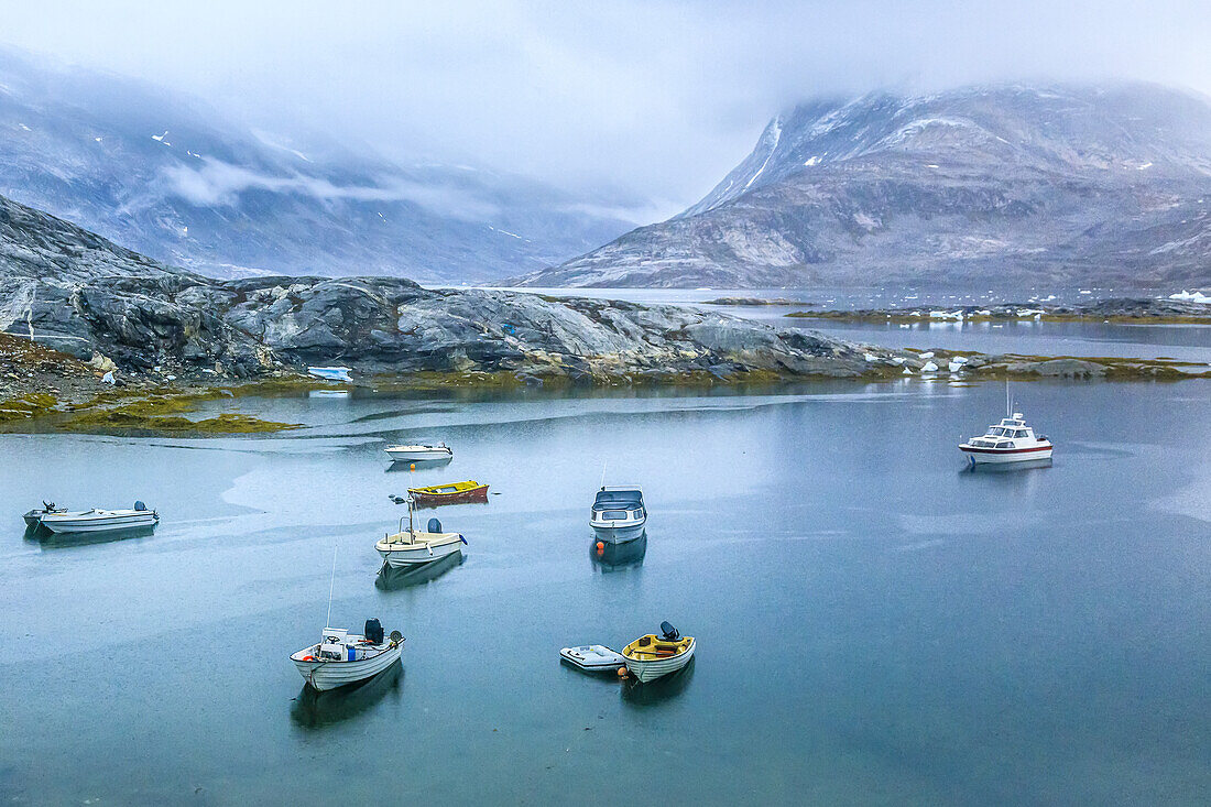 Boats in the harbor of the Inuit village of Tiniteqikaq.