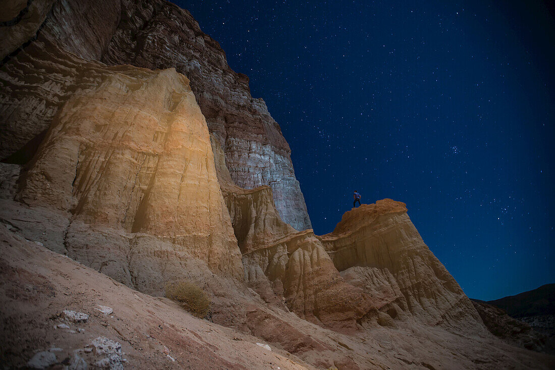 A man looks up at Red Rocks in the eastern Sierra Nevada Mountains.